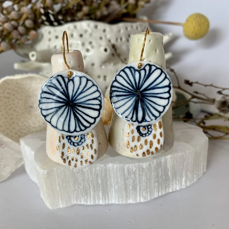 Simple silver drop earrings for understated elegance -Blue and white hand painted porcelain earrings with gold lustre detail.